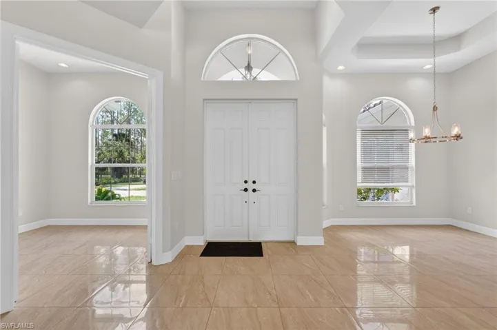 Front entry, den and formal dining area