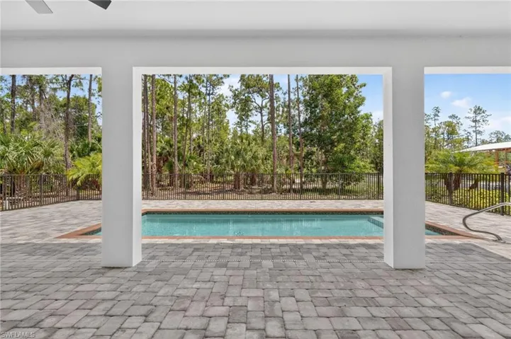 View of Pool area and yard from Great room and Dining area