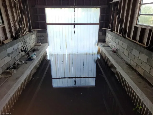 There are steel beams in the boathouse, a lift could be installed