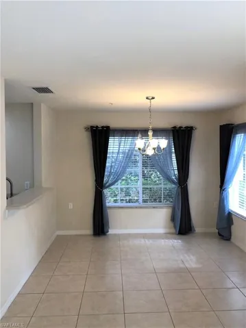 The dining room easily accommodates a large table and the pass through from the kitchen makes hosting a breeze