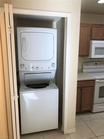located next to the 1/2 Bath & kitchen on the main floor is the washer and dryer