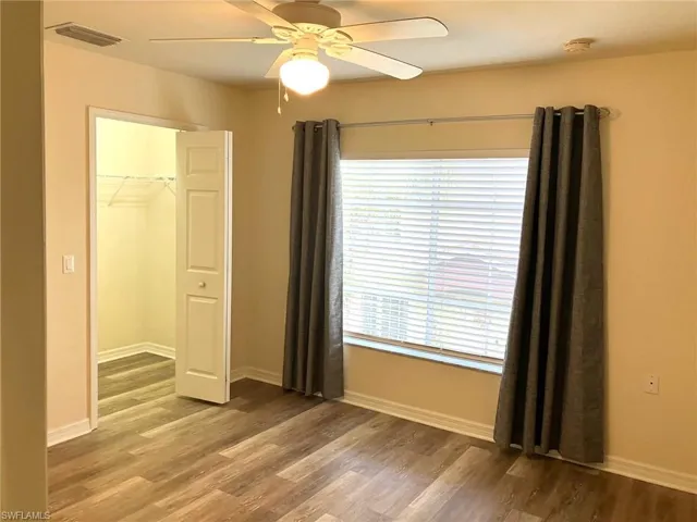 The walk in closet offers nice storage while the large window offers light and views