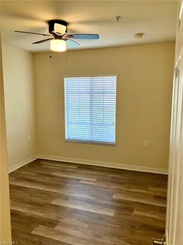 A 2nd guest bedroom with fan and large closet