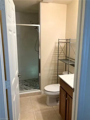 The attached primary bathroom features a newly renovated shower