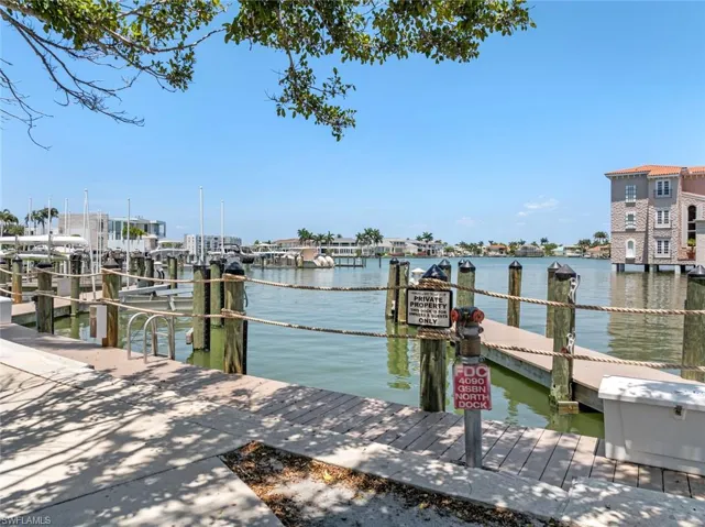 Dock area featuring a water view