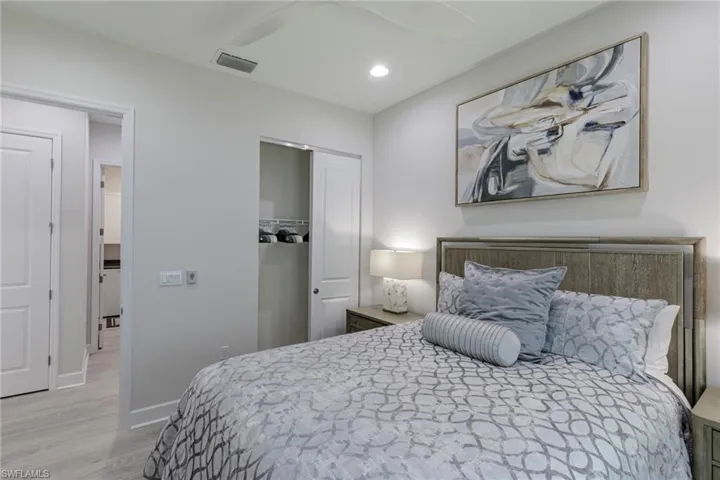 Bedroom featuring a closet, light wood-type flooring, and ceiling fan