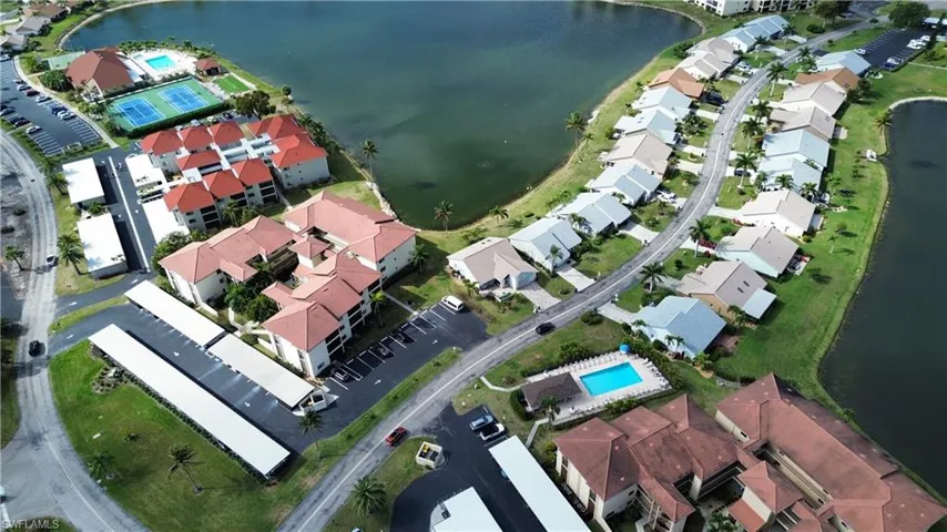 Aerial view of property and surrounding area featuring a large body of water