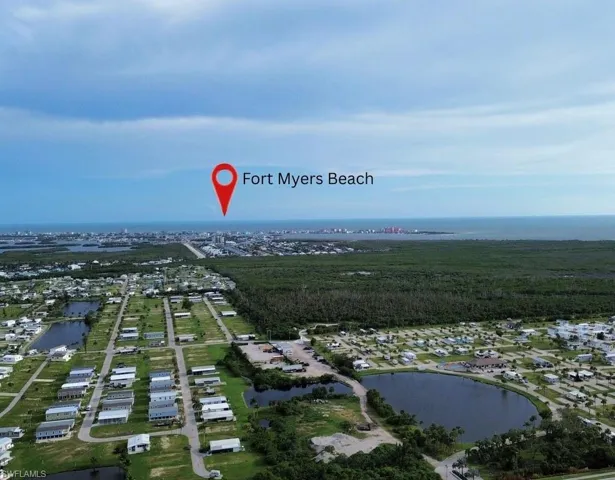 Aerial perspective of suburban area with a large body of water