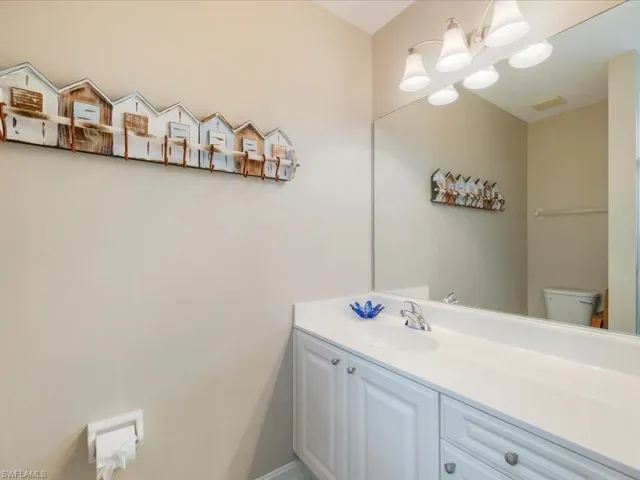 Bathroom featuring vanity and toilet
