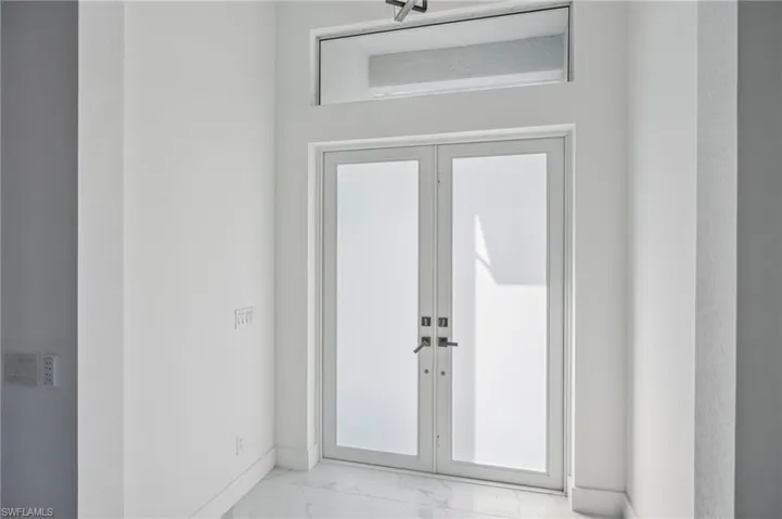 Property entrance with french doors