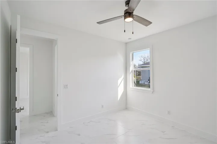 Spare room featuring ceiling fan