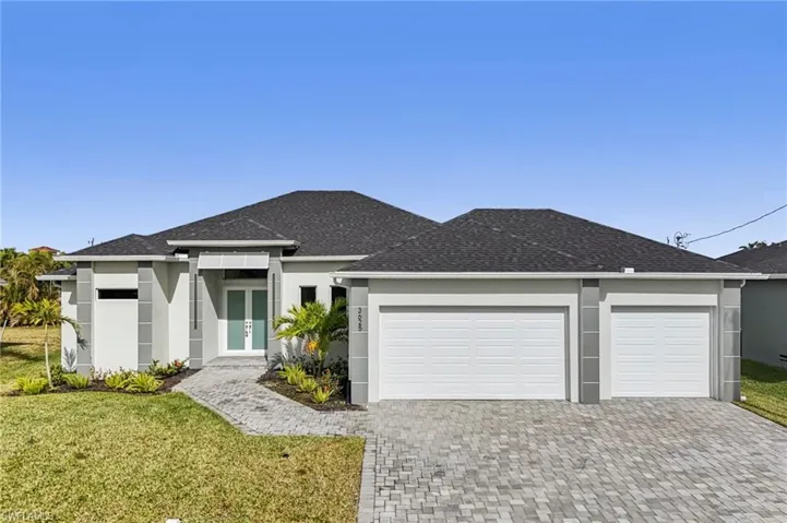 Prairie-style house featuring a garage and a front yard