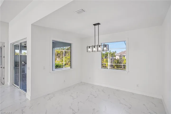 Unfurnished dining area featuring plenty of natural light