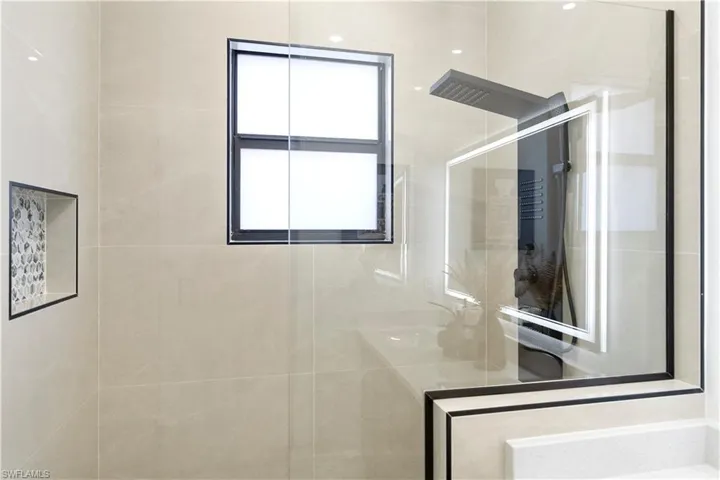 Full bath with a shower stall