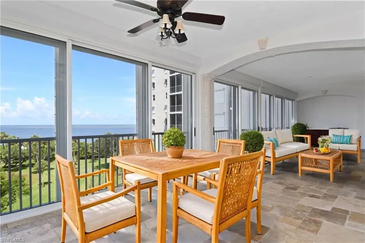Front lanai with water view, ceiling fan, and plenty of natural light