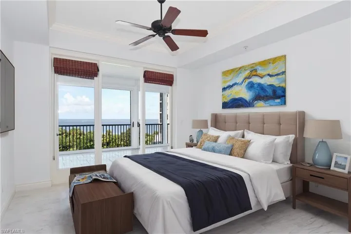 Second bedroom adjacent to front lanai with ceiling fan