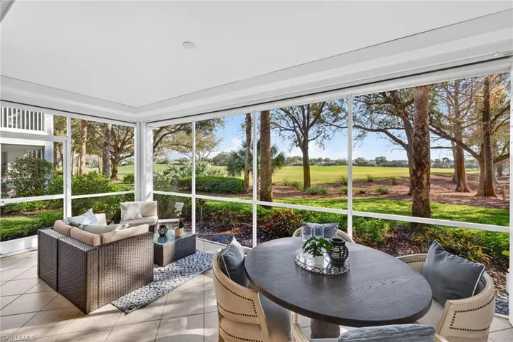 Sunroom / solarium with outdoor lounge area and view of golf course