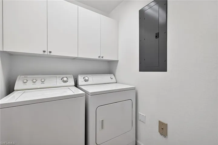Laundry room featuring cabinet space and washing machine and dryer