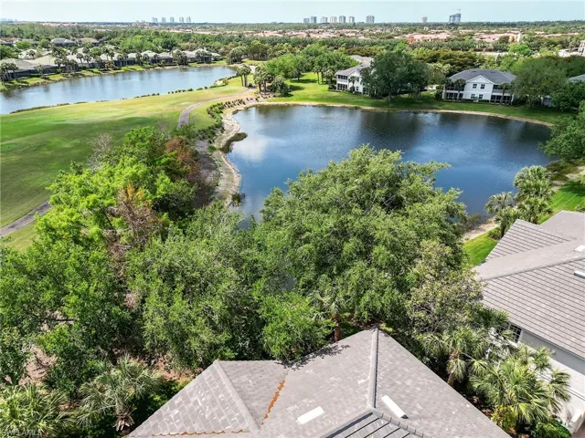 Drone / aerial view of skyline and a nearby body of water
