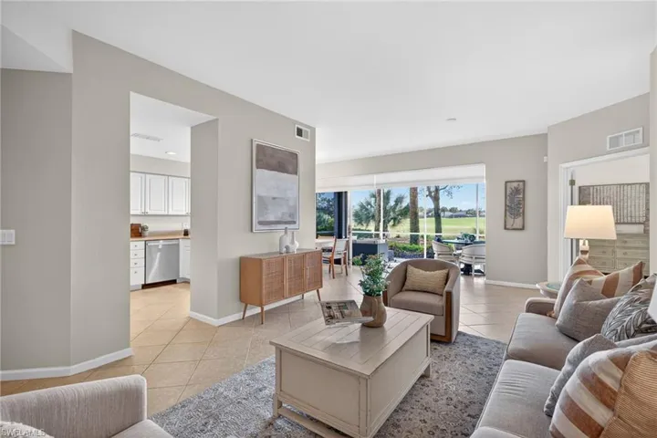 Living room featuring baseboards and light tile patterned flooring