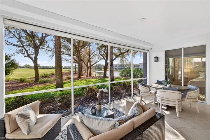 Sunroom featuring outdoor lounge area and view of golf course