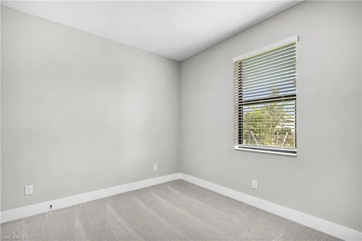 Empty room with carpet flooring