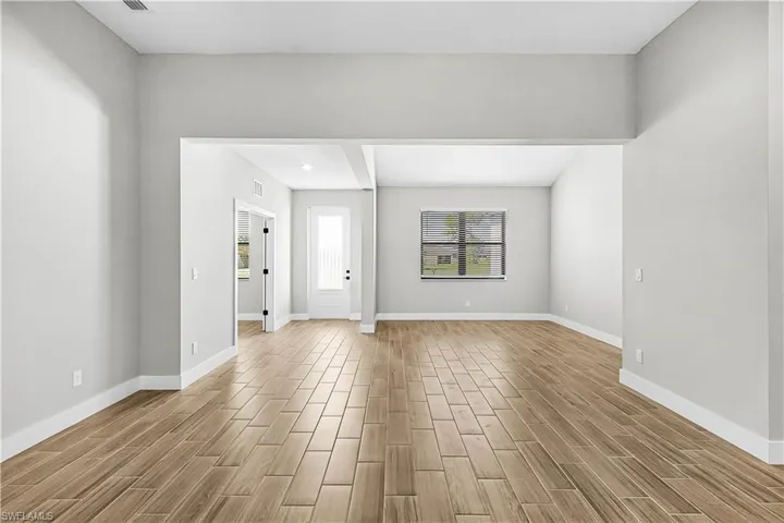 Empty room with wood finish floors and baseboards