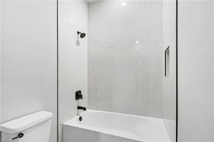 Full bathroom featuring shower / bathtub combination and toilet