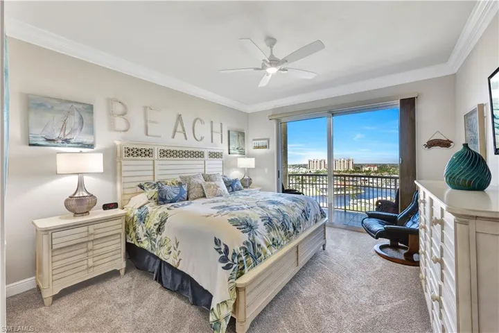 Bedroom featuring light carpet, crown molding, access to exterior, and ceiling fan