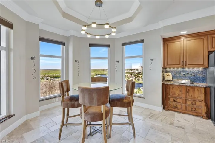 Dining room featuring crown molding and a healthy amount of sunlight