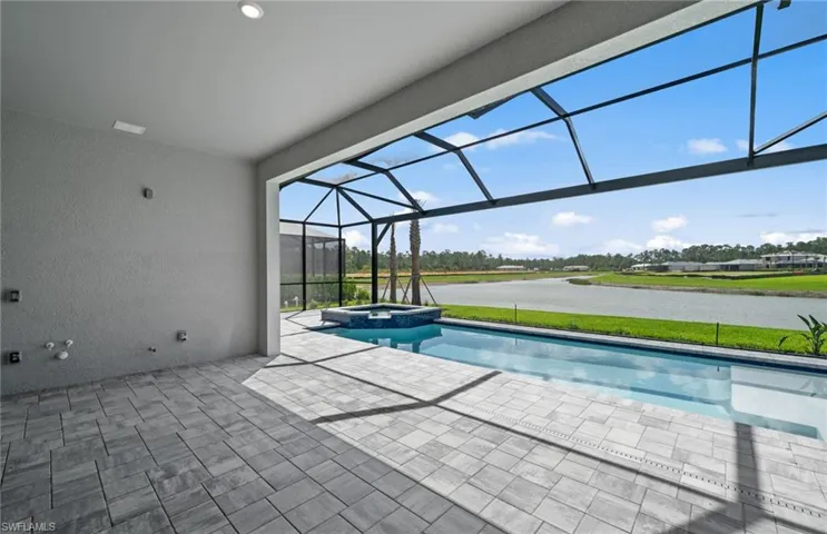 Outdoor kitchen pre-plumbing. Rear facing south. Custom pool/spa with sunshelf