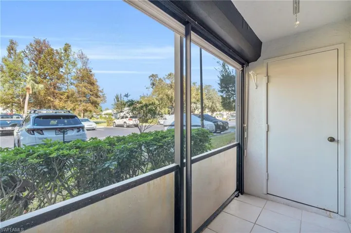 Step onto the balcony from living room which has a storage closet