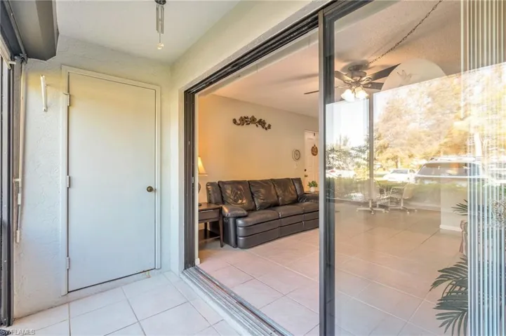 Step onto the balcony from living room which has a storage closet