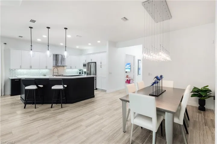 Great room facing kitchen and dining area.