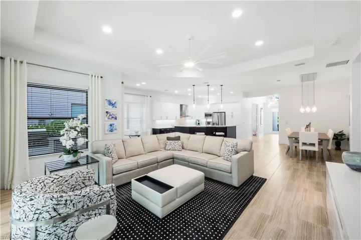 Great room facing the kitchen, dining room and hallway to the front door.
