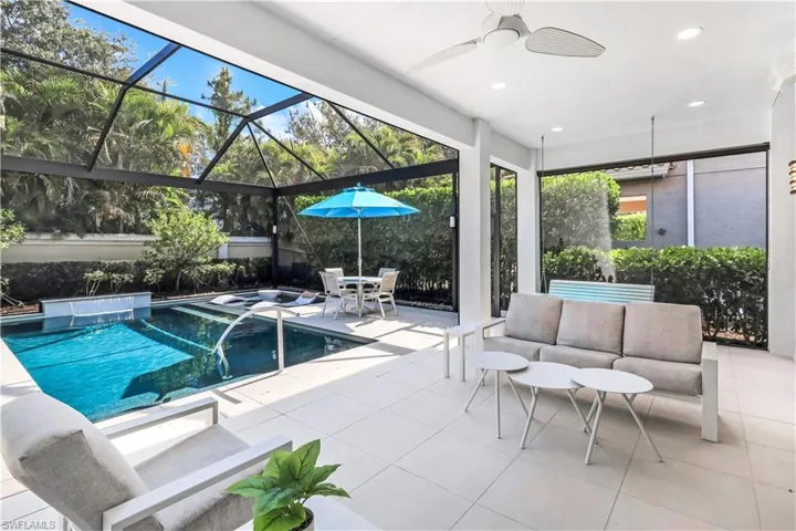 Fabulous lanai with under cover area, large pool, lounge area, electric hurricane screens and built-in kitchen (not shown).
