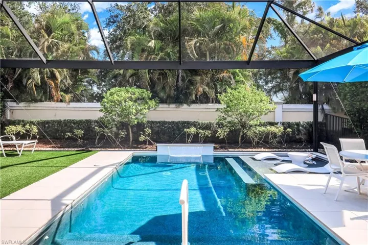 Pool with sundeck and enclosed lanai