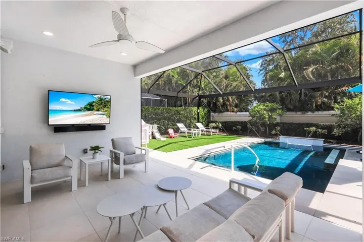 Fabulous lanai with under cover area, large pool, lounge area, electric hurricane screens and built-in kitchen (not shown).