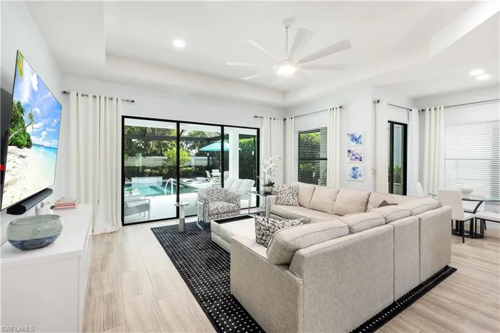 Great room with view and access to the lanai with pool and breakfast nook area.