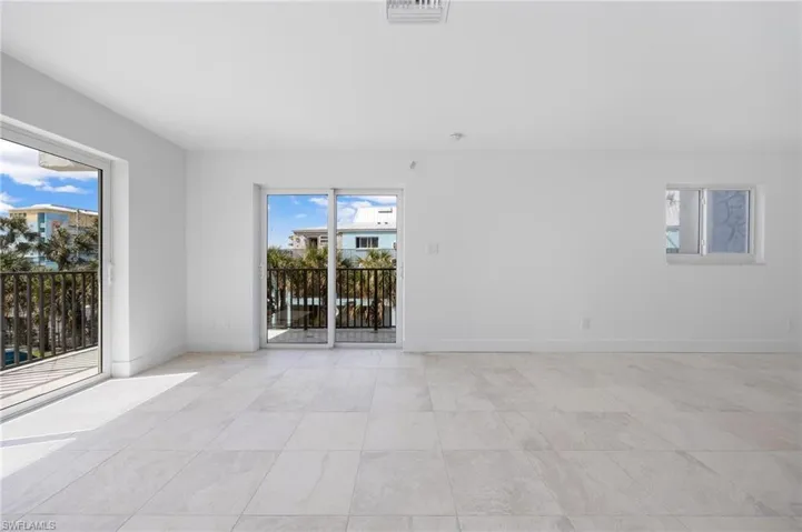 Unfurnished room featuring a wealth of natural light