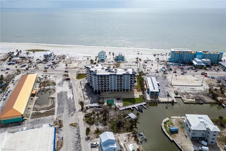 Aerial view with a water view and a beach view