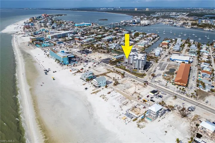 Bird's eye view featuring a view of the beach and a water view