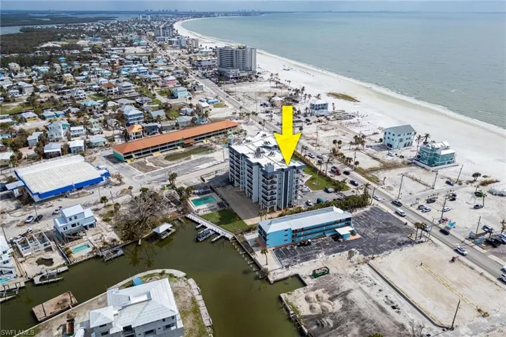 Drone / aerial view with a beach view and a water view