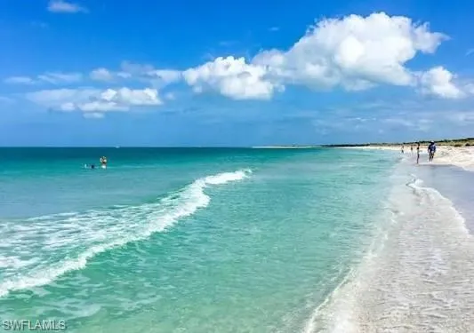 Beach on opposite side of street during the day