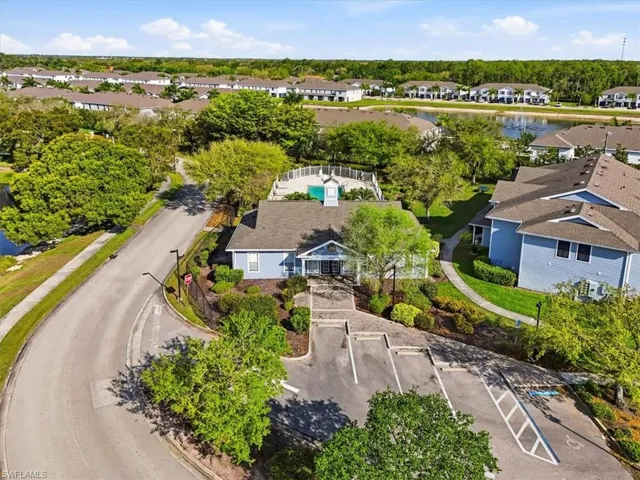 Aerial view of residential area featuring a large body of water