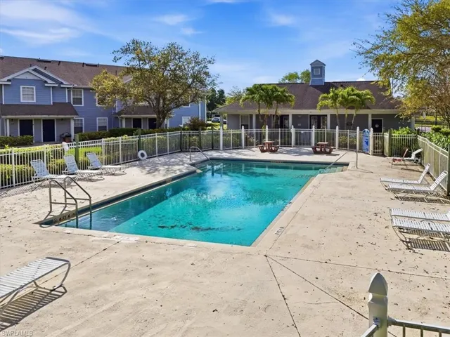 Community pool with a patio area