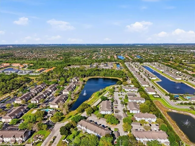 Aerial perspective of suburban area with a nearby body of water