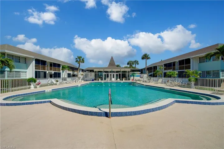 Beautiful, heated community pool featuring a patio.