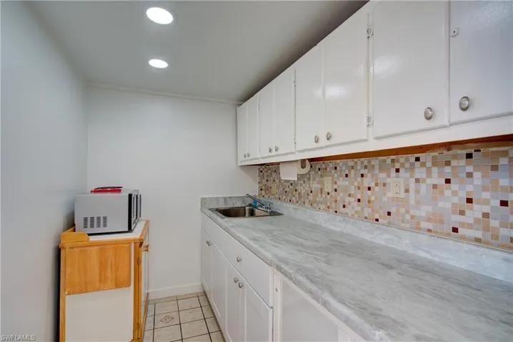 Community Center amenities include a small kitchen area.  Microwave, sink, storage.