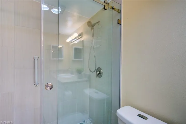 Full bath featuring a stall shower